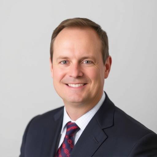 David Evans, Legal Counsel, looking professional in a suit and tie.